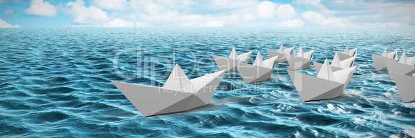 Composite image of paper boats made of origami