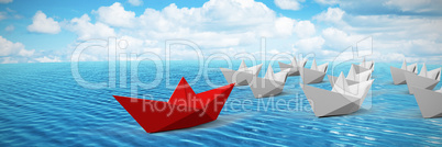 Composite image of red and white paper boats arranged
