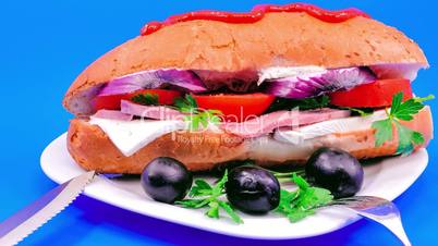 Sandwich with sausage and white cheese.