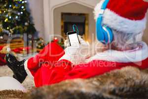 Santa claus using digital tablet at home