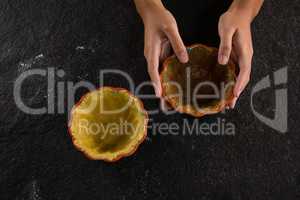 Woman holding tart dough on mold