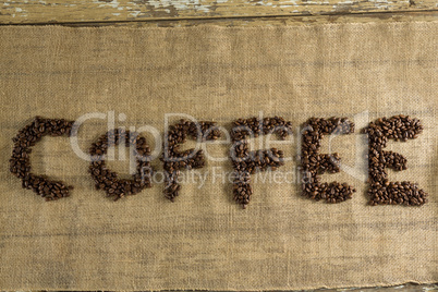 Word coffee arranged with coffee beans