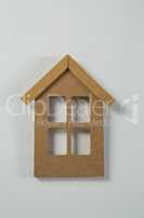 Wooden house shape decoration on table