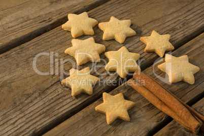 Close up of Christmas tree made with star shape cookie and cinnamon stick