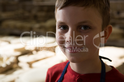 Smiling boy in pottery workshop