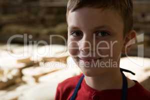 Smiling boy in pottery workshop