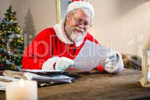 Santa Claus reading a letter