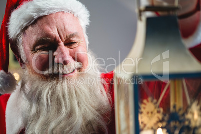 Santa Claus holding Christmas lantern