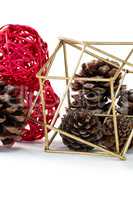 Pine cones and christmas decoration against white background