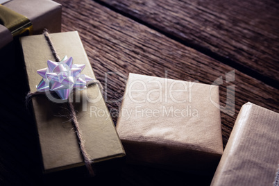 Various gift boxes on wooden plank