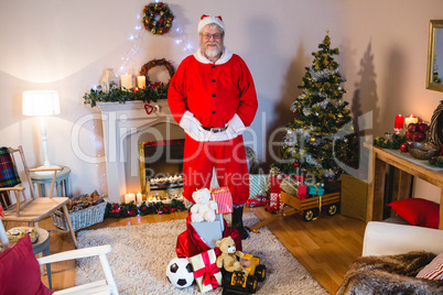 Santa claus standing with his hands on waist