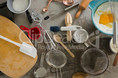 Gingerbread cookies ingredients with various utensils on table