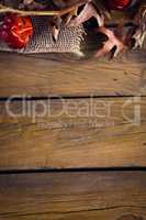 Dry leaves and mistletoe on wooden plank