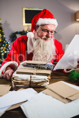 Santa Claus reading a letter