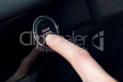 Cropped ifinger pressing car start button