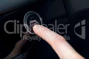 Cropped ifinger pressing car start button