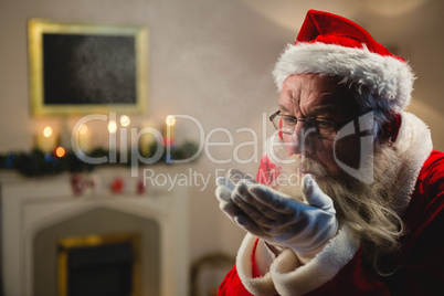 Santa Claus blowing kiss