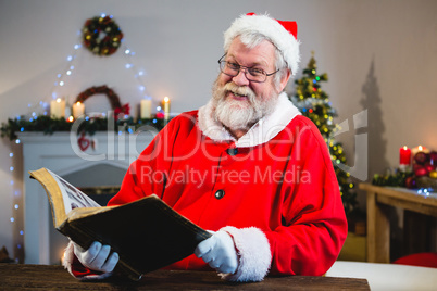 Santa Claus reading book