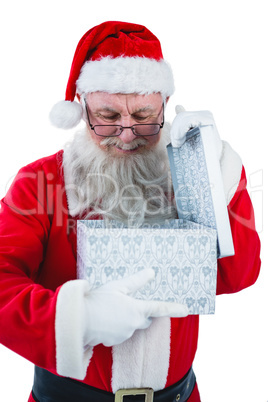 Santa Claus opening a gift box Santa Claus opening a gift box
