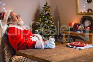 Santa Claus sleeping on chair