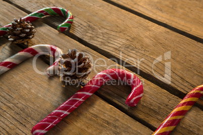 High angle view of colorful candy canes with pine cones