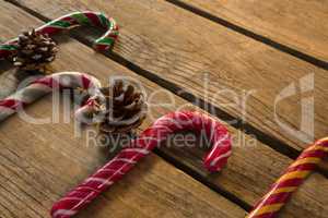 High angle view of colorful candy canes with pine cones