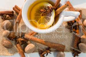 Spice tea with various ingredients on white background