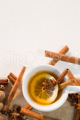 Spice tea with various ingredients on white background