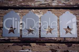 Tags with star shape on wooden plank