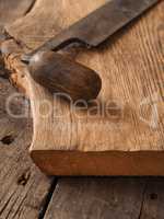 Old wood plane on oak plank