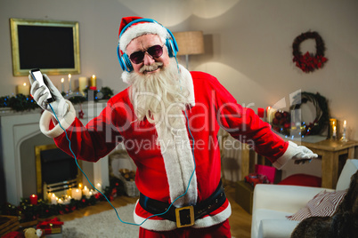 Smiling of santa claus singing a christmas songs at home