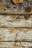 Cookies with christmas decoration arranged on wooden plank