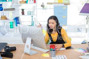 Female executive working on computer
