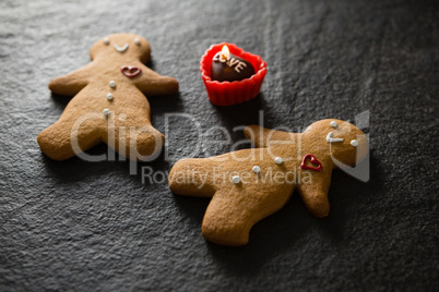 Gingerbread and chocolate on concrete background