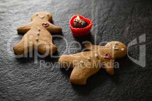 Gingerbread and chocolate on concrete background