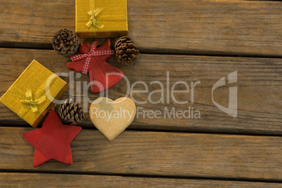 Overhead view of pine cones with gift boxes