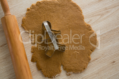Cookie cutter placed over flattened dough