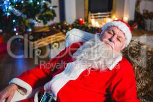 Santa Claus sleeping on couch