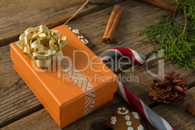 Close up of gift box by candy cane and spice