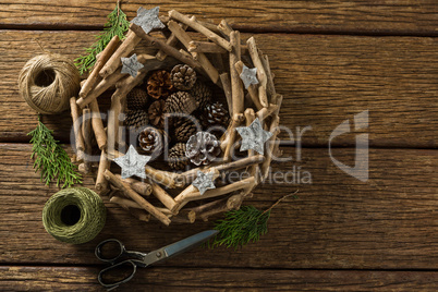 Directly above shot of artificial nest with decoration and thread spools