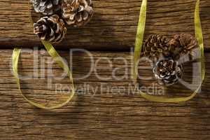 Overhead view of pine cones with ribbon