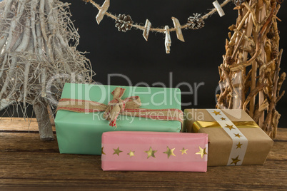 Close up of gift boxes with Christmas decoration on table
