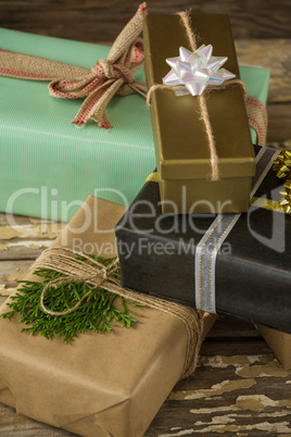 Various wrapped gift box on wooden table