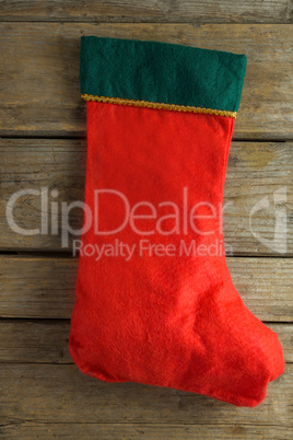 Christmas stocking on wooden plank