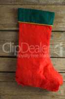 Christmas stocking on wooden plank