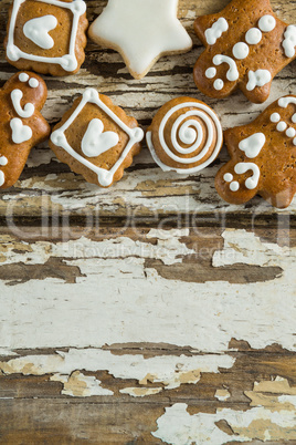 Gingerbread cookies arranged on wooden plank