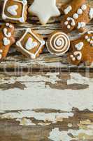 Gingerbread cookies arranged on wooden plank