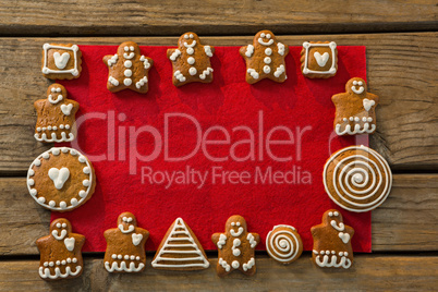 Overhead view of gingerbread cookies arranged on fabric