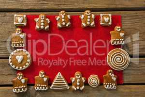 Overhead view of gingerbread cookies arranged on fabric