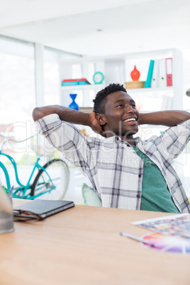 Male executive relaxing at his desk